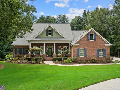 Brick and siding home with landscaped lawn at 203 Northampton Court